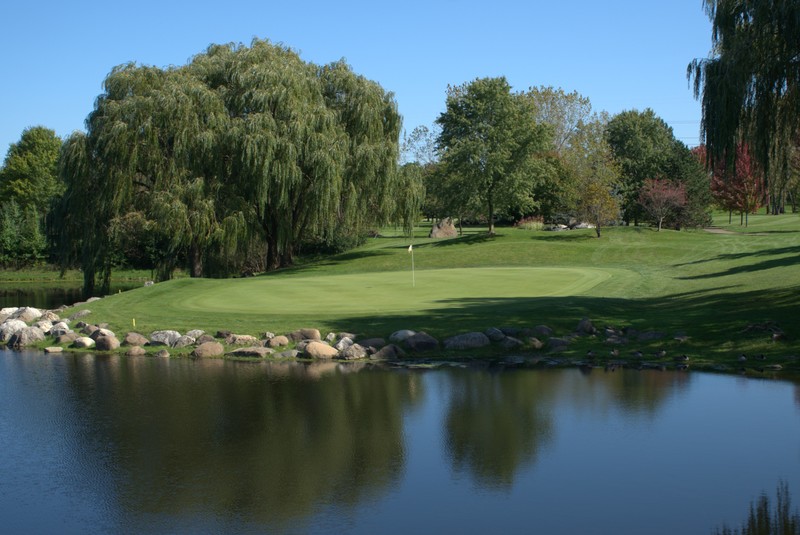 Course greens with lake in the forefront